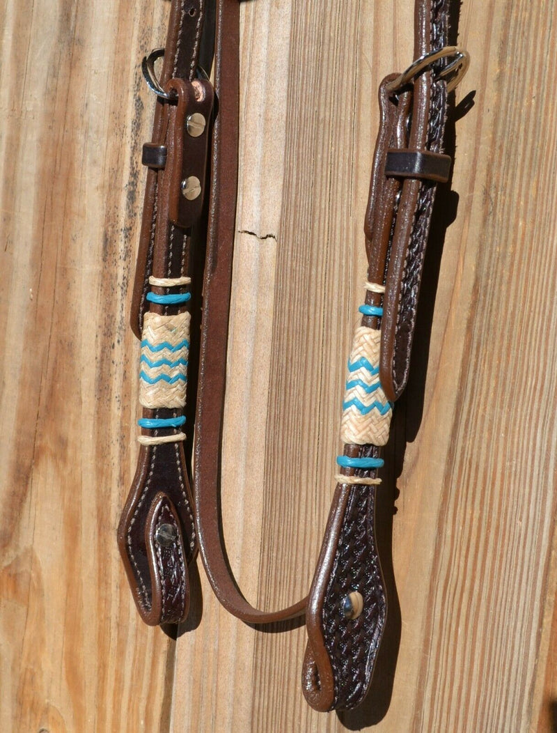 Jose Ortiz 5/8" Straight Browband Headstall.  Constructed of two-ply and stitched dark chocolate oil  finished leather.  Hand carved with Jose's signature basket weave tooling and natural hand braided rawhide with turquoise details on cheek pieces and browband.