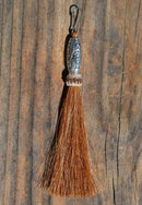 Close Up View 4 1/2" total length horsehair zipper pull with spring clip. Handmade horsehair various colors and beading pattern. Sorrel-Silver