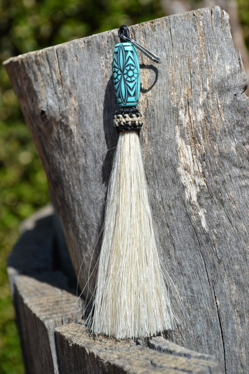 Close Up View 4 1/2" total length horsehair zipper pull with spring clip. Handmade horsehair various colors and beading pattern. White-turquoise
