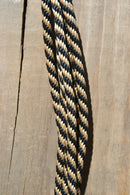 Close Up View 1/4" Solid Braid Get Down Rope, 14 foot long.    This one has a knot on one end and a short leather popper on the other.   Black/Tan.