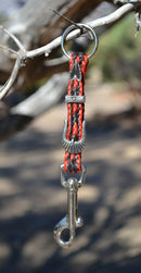 Close Up View Handmade natural horsehair braided key chain with silver tone faux buckle and snap. This key chain is about 6" long including the 1" key ring loop to connect the keys.    Red/Black