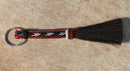 Close Up View Awesome 3/8" wide, 3 Strand Braided Horsehair Key Chain. Full length is 7" including the key ring.    Red/white/Black