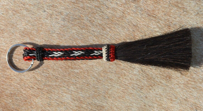 Close Up View Awesome 3/8" wide, 3 Strand Braided Horsehair Key Chain. Full length is 7" including the key ring.    Red/white/Black