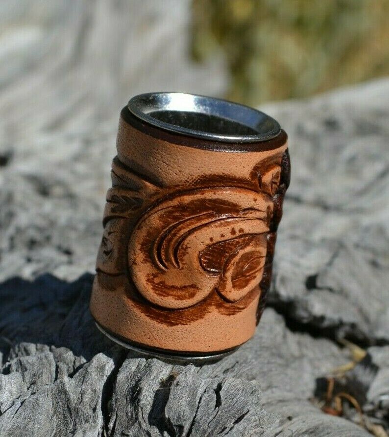 Tan - Brand new,  Western Style Hand Carved Floral Swirl Leather Scarf Slide.   Slide measures W 1" x  H 1 1/2" x D 7/8".  Smooth stainless steel inside will slide nicely over most fabrics without out snagging.     Available in a variety of colors.  