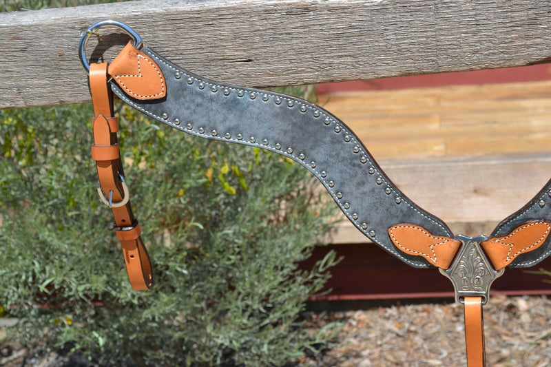 Close Up Alamo Saddlery Wave Contoured Breast Collar.  This breast collar is Alamo's light oil color with steel grey leather overlay outlined in silver colored studs.
