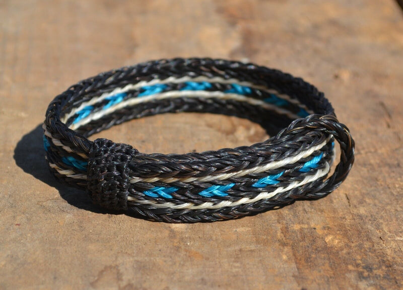 Awesome 5/8" wide, 5 Strand Braided Horsehair Bracelet with sliding knot.  The unique sliding knot design can expand up to 10".  Unisex.  Very durable and makes a great gift for any horse lover. Black/Turquoise/Black