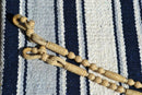 Close Up View Rawhide Rein Connectors. Beautiful Jose Ortiz Romel Reins, 12 plait Hand Braided Light Natural Variegated Rawhide braided in the Oklahoma style with round knots and long buttons