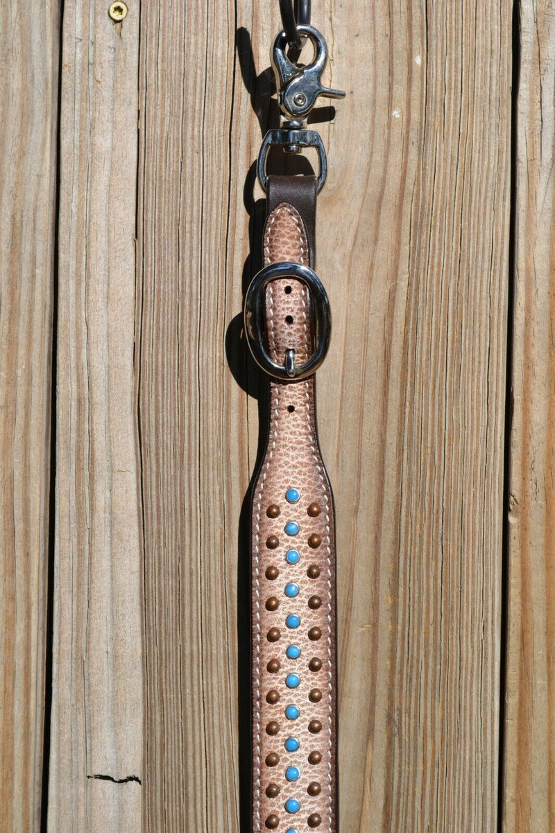 Close Up View Circle Y of Yoakum -  Desert Racer Breast Collar Tie-up Wither Strap.   1 1/2" wither strap had textured cream colored leather with turquoise and antiqued colored spots.   Stainless steel buckles are adjustable on both sides.
