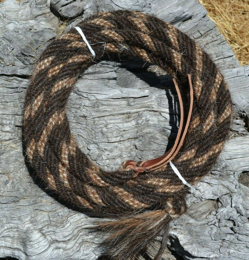 Hand made by Jose Ortiz, 5/8" x 22' mecate made from 6 tightly hand twisted strands of  super dark liver chestnut, sorrel & white mane hair with a soft leather popper at one end turks head knot on the other.  
