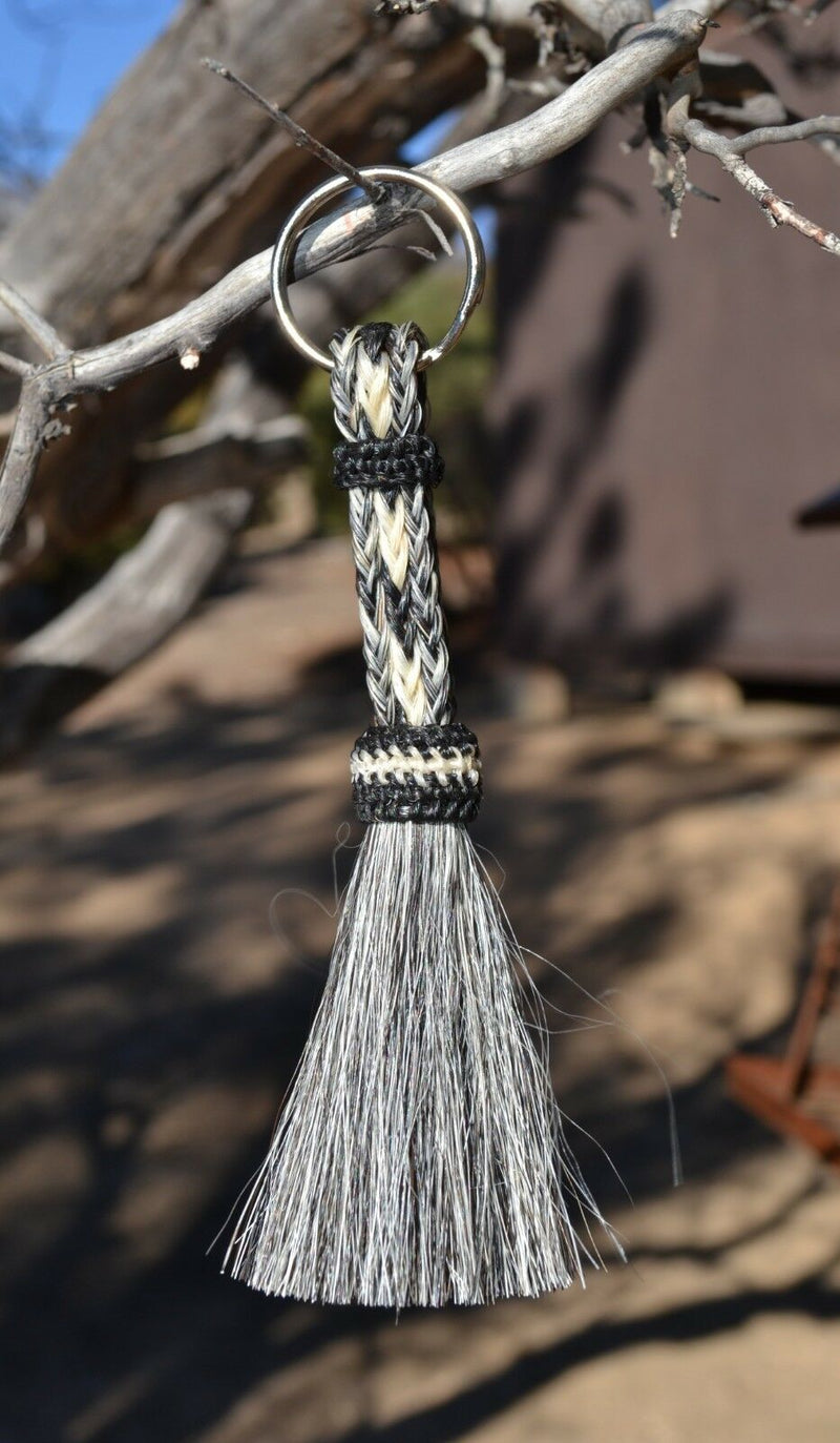 Close Up View 3/8" wide, 3 Strand Braided Horsehair Key Chain. This shorter style is 5 1/2" including the key ring.    Grey/Black/White