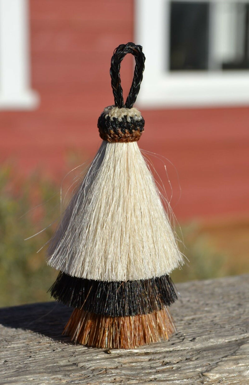 Close Up View 3" 3 bell mule tail cut natural and brightly colored tassels. Handmade from 100%  horsehair. White/Black/Sorrel