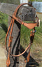 Front View Light russet oil 5/8"wide browband headstall with quick change connectors at the bit end. Constructed of two-ply and stitched natural russet bridle leather with hand rubbed and finished edges and adorned with brown hand braided beveled rawhide. 