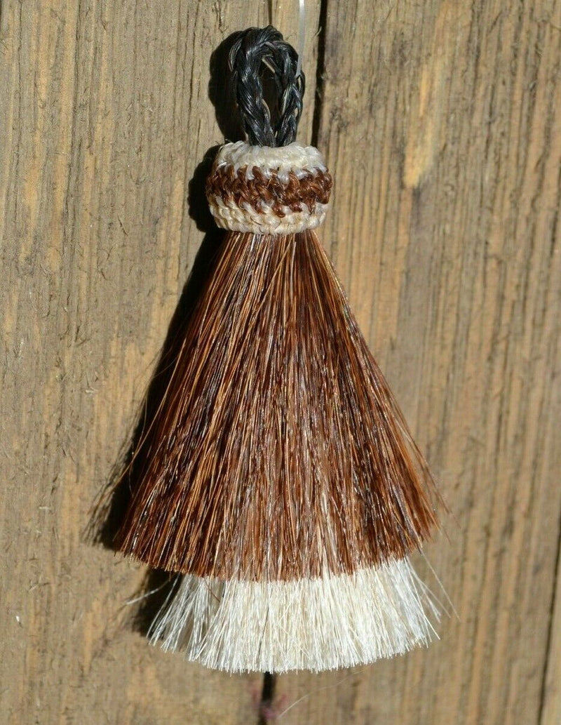 Close Up View 3" two Bell mule tail cut natural and brightly colored tassels. Handmade from horsehair dyed in bright colors as well as natural.    Brown/White