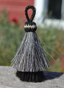 Close Up View 3" two Bell mule tail cut natural and brightly colored tassels. Handmade from horsehair dyed in bright colors as well as natural.    Grey/Black