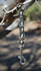 Close Up View Handmade natural horsehair braided key chain with silver tone faux buckle and snap. This key chain is about 6" long including the 1" key ring loop to connect the keys.    Black/White