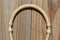 Close Up View Noseband Jose Oritz 1/4" hand braided light natural rawhide bosal with round shaped knot.  This bosal has 12 plait cheeks over a flexible all rawhide core.