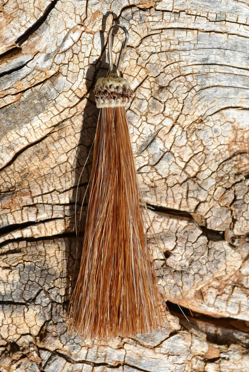    Close Up View 3" total length natural horsehair zipper pull with spring clip. Handmade from 100% natural mane horsehair. Sorrel