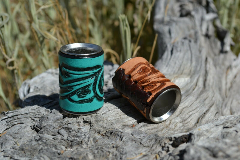 Brand new,  Western Style Hand Carved Floral Swirl Leather Scarf Slide.   Slide measures W 1" x  H 1 1/2" x D 7/8".  Smooth stainless steel inside will slide nicely over most fabrics without out snagging.     Available in a variety of colors.  