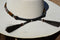 Close Up Back View Horsehair Tassels Beautiful 1/2" Hand Made Beaded Hatband with Long Bone Beads.  Made from 7 strands of black, brown and white beads and 1" wide amber color bone beads. 