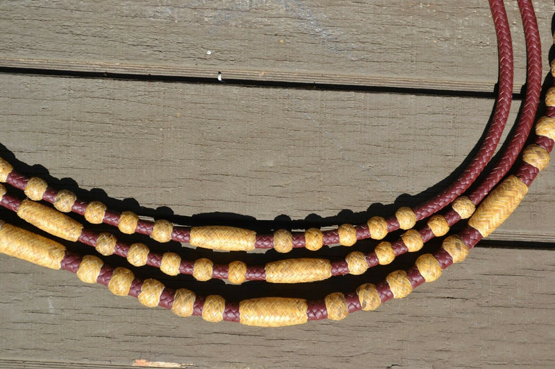 Close Up View Handmade Romel Reins. Beautiful Hand Braided Latigo Leather Romel Reins, 12 plait Hand Braided Natural Rawhide braided in the Oklahoma style with round knots. 