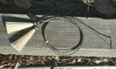 Close Up View natural horse hair stampede string with cotter pin attachments. Black/White/Grey/White