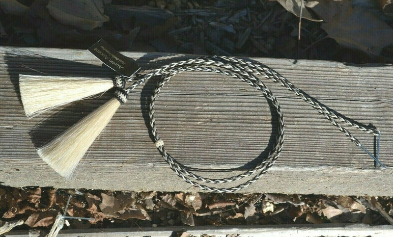 Close Up View natural horse hair stampede string with cotter pin attachments. Black/White/Grey/White