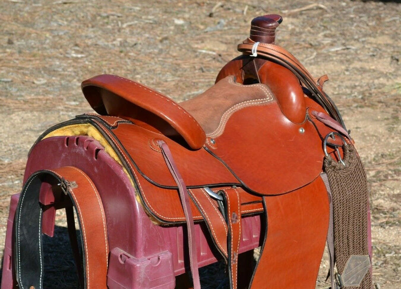16" Dakota Roping Saddle with tan suede seat.   Includes flank set, martingale style breast collar, plain headstall and reins.  Full set ready to ride.  Smooth finish medium oil.  Square skirts.  