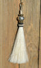 Close Up View 4 1/2" total length horsehair zipper pull with spring clip. Handmade horsehair various colors and beading pattern. White-Gold/RBS/Gold
