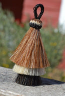 Close Up View 3" 3 bell mule tail cut natural and brightly colored tassels. Handmade from 100% horsehair.    Sorrel/White/Black