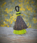 Close Up View 3" two Bell mule tail cut natural and brightly colored tassels. Handmade from horsehair dyed in bright colors as well as natural.    Black/Lime