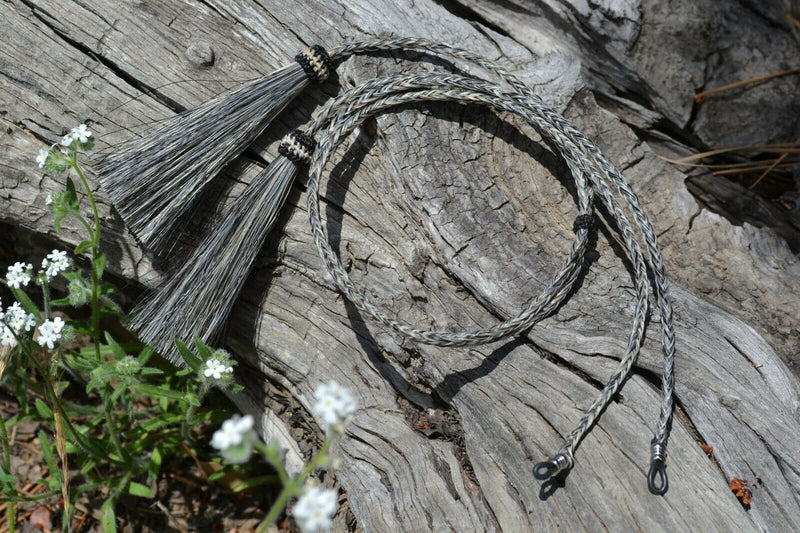 Close Up View Western Style 1/4" wide and 24" long, braided horse hair eye glass holder (gator/leash) with tassels.    Salt & Pepper Grey
