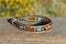 Close Up View Awesome 3/8" wide, 3 Strand Braided Horsehair Bracelet with a lobster claw clasp and various colored and patterned bone beads. White/Chestnut/Turquoise/Skull