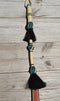 Close Up View Beautiful Jose Ortiz Braided Rawhide Quirt Whip with Hitched Horsehair Knots and Hand Tooled Leather Popper. Natural colored rawhide with turquoise blue and black details. 