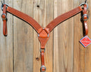 Reinsman Heavy Duty 2" Double Ply Contoured Breast Collar with Hand Carved with Snowflake Tooling.    Stainless steel hardware and tugs.   1" x 12" adjustable elastic tugs.   Mahogany color.