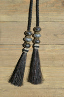 Super Close Up Detail View natural horse hair Stampede String with beads and horse hair tassels and cotter pin attachments.  Black-Silver/Gold/Silver