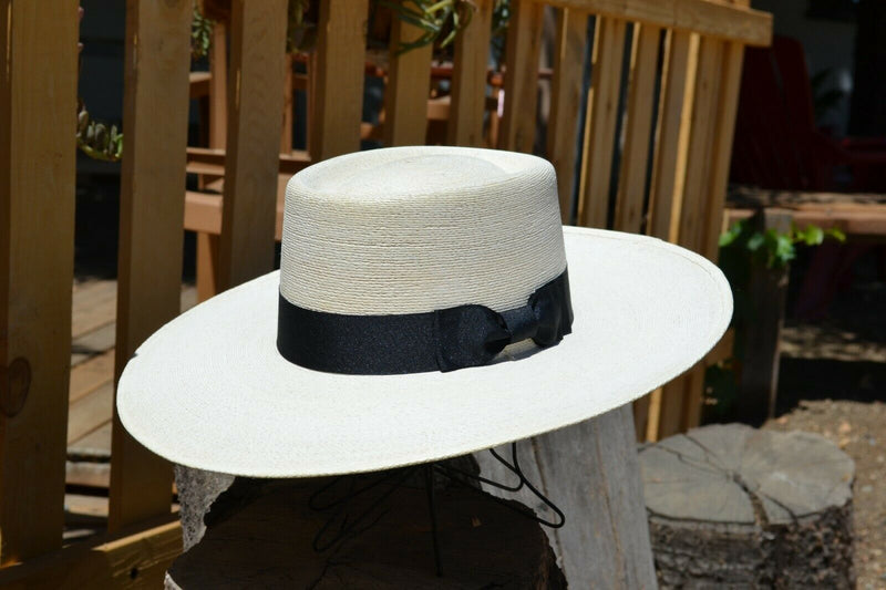 Atwood Hat Company - 4.25" Flat Brim Buckaroo Style Hat - Long Oval - 7X Palm Leaf - Designed with a buckaroo brim, the flat brim with a slight tilt down in front and curl up in the back.  Hatband is a wide black ribbon with traditional bow.