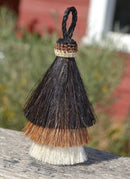 Close Up View 3" 3 bell mule tail cut natural and brightly colored tassels. Handmade from 100% horsehair.    Black/Sorrel/White