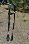 Jose Ortiz 5/8" One Single Ear Headstall.  Constructed of two-ply and stitched black finished leather.  Hand carved with Jose's signature basket weave tooling and natural hand braided rawhide with burgundy latigo details on cheek pieces and ear pieces.   