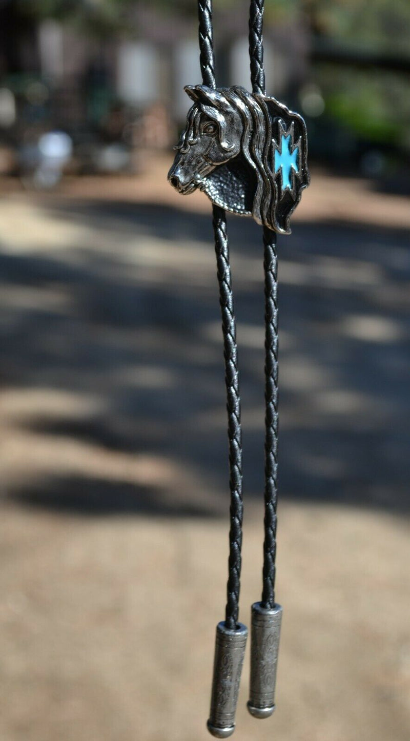 Close Up View Western Style Black Braided Leather Bolo Tie with beautifully detailed horse head slide in silver with black and turquoise southwest enamel design. 