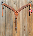 Reinsman Heavy Duty 2" Double Ply Contoured Breast Collar with Hand Carved with Waffle Box Tooling.    Stainless steel hardware and tugs.   1" x 12" adjustable elastic tugs.   Old West antiqued wash color.