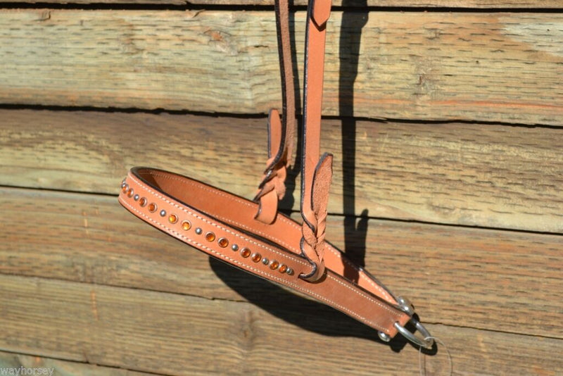 Detailed View Light oil Noseband with orange crystals, alternating stainless steel studs and white stitching.