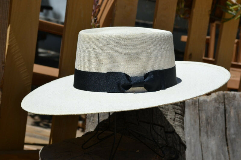 Atwood Hat Company - 4.25" Flat Brim Buckaroo Style Hat - Long Oval - 7X Palm Leaf - Designed with a buckaroo brim, the flat brim with a slight tilt down in front and curl up in the back.  Hatband is a wide black ribbon with traditional bow.