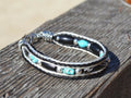 Close Up View Awesome 3/8" wide, 3 Strand Braided Horsehair Bracelet with a lobster claw clasp and various colored and patterned bone beads. White/Black/Turquoise/Skull