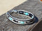 Close Up View Awesome 3/8" wide, 3 Strand Braided Horsehair Bracelet with a lobster claw clasp and various colored and patterned bone beads. White/Black/Turquoise/Skull