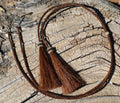 Close Up View natural horse hair stampede string with cotter pin attachments. Chestnut