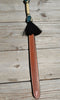Close Up View Beautiful Jose Ortiz Braided Rawhide Quirt Whip with Hitched Horsehair Knots and Hand Tooled Leather Popper. Natural colored rawhide with turquoise blue and black details. 
