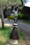 Close Up View  4.25" total length natural horsehair zipper pull with Larger Clasp. Handmade horsehair in the two bell mule tail style.    Black/White