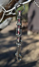 Close Up View Handmade natural horsehair braided key chain with silver tone faux buckle and snap. This key chain is about 6" long including the 1" key ring loop to connect the keys.    Black/Burgundy/White