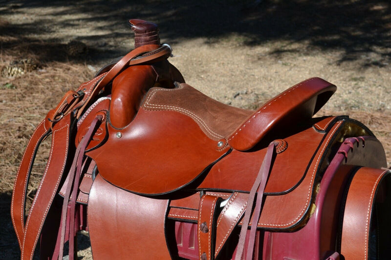 16" Dakota Roping Saddle with tan suede seat.   Includes flank set, martingale style breast collar, plain headstall and reins.  Full set ready to ride.  Smooth finish medium oil.  Square skirts.  