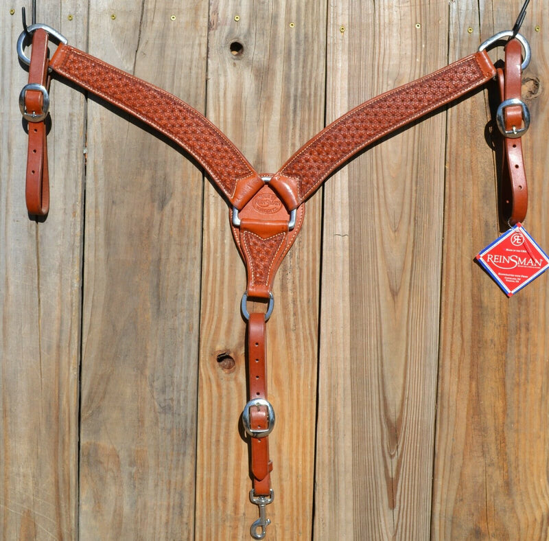 Reinsman Heavy Duty 2" Double Ply Contoured Breast Collar with Hand Carved with Snowflake Tooling.    Stainless steel hardware and tugs.   1" x 12" adjustable elastic tugs.   Mahogany color.